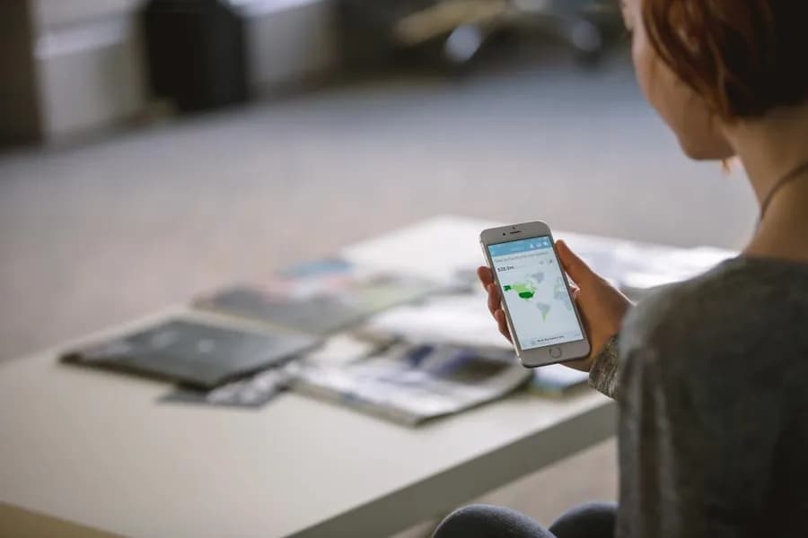 A person using a phone at a desk