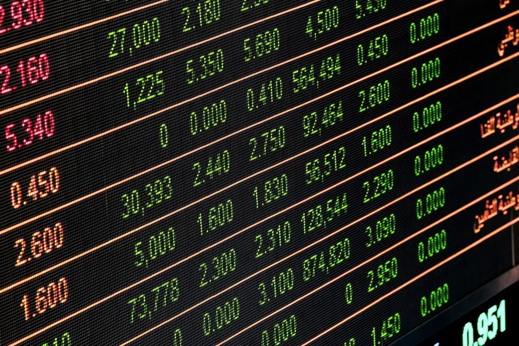 A board of market prices displayed in red and yellow digits