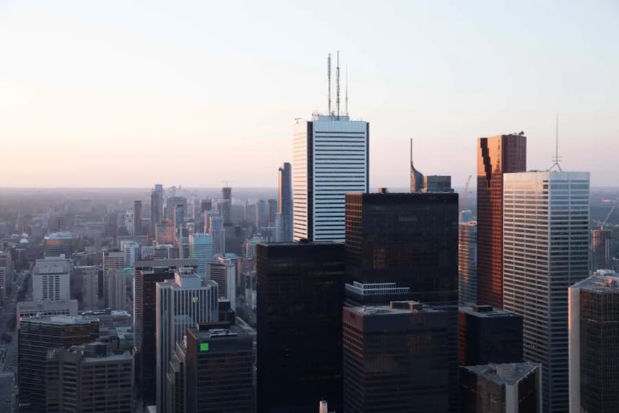 An aerial view of a downtown district at dusk