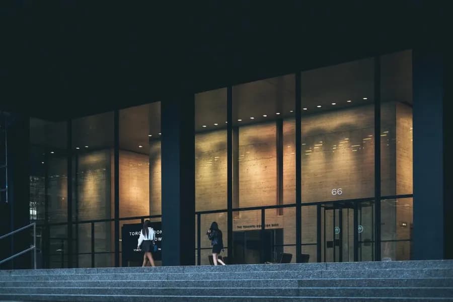 An office building lit from within at dusk