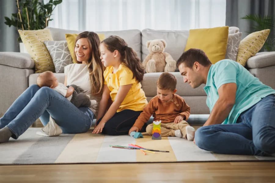 A family together in a living room at home