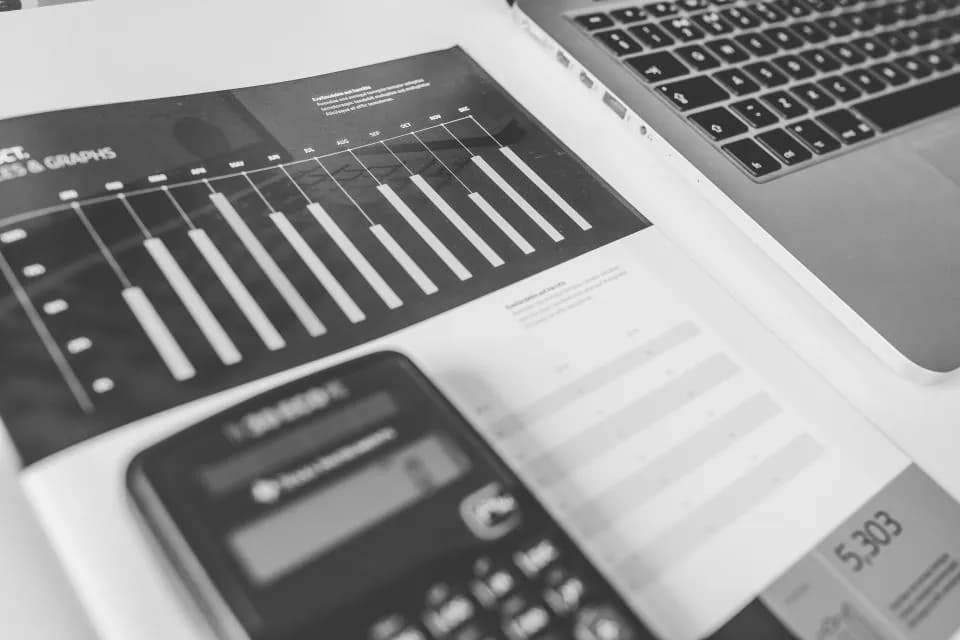 A printed chart beside a calculator