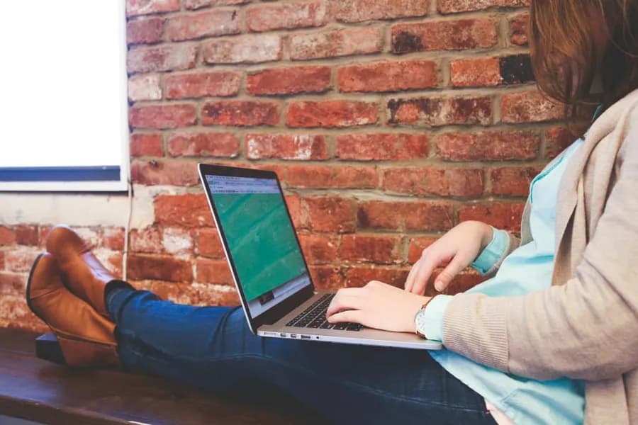 A person reviewing an account on a laptop